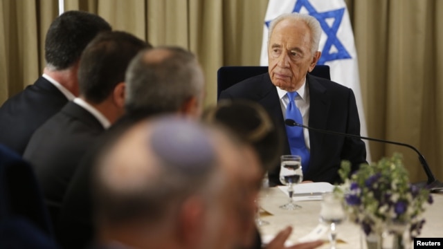 srael's President Shimon Peres (R) sits next to representatives of Israeli Prime Minister Benjamin Netanyahu's Likud-Beitenu party in Jerusalem Jan. 30, 2013, after receiving the official results of the general elections held Jan. 22.