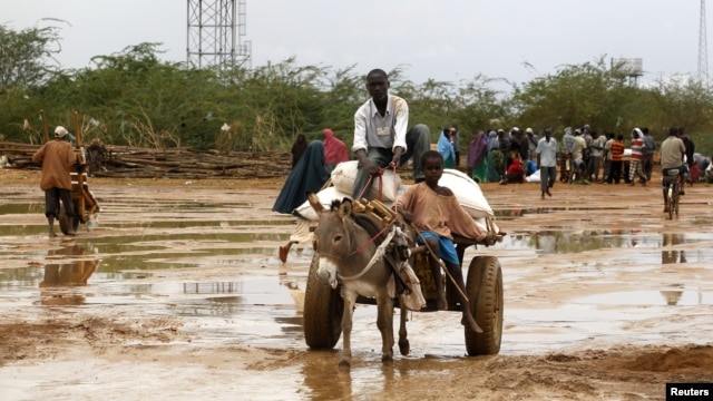 Newly arrived Somali refugees ride a donkey along the street at the Ifo Extension refugee camp in Dadaab, near the Kenya-Somalia border, October 19, 2011. 
