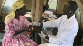 A woman is given a free HIV/AIDS test in Lira, northern Uganda, September 9, 2007. 