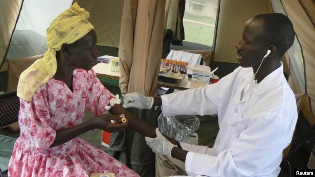 A woman is given a free HIV/AIDS test in Lira, northern Uganda, September 9, 2007. 