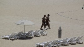 Mexican soldiers patrol the beach of San Jose del Cabo in Mexico's Baja Peninsula, Sunday, June 17, 2012. The G-20 summit starts in Los Cabos on Monday.