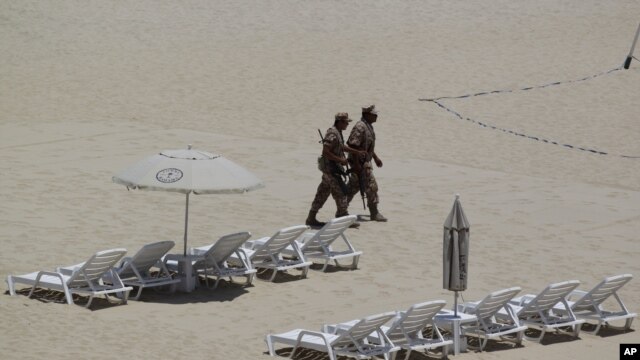 Mexican soldiers patrol the beach of San Jose del Cabo in Mexico's Baja Peninsula, Sunday, June 17, 2012. The G-20 summit starts in Los Cabos on Monday.