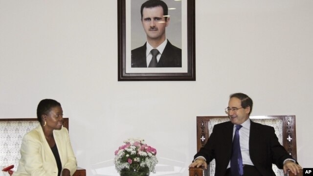 UN Under-Secretary-General for Humanitarian Affairs and Emergency Relief Coordinator, Valerie Amos, meets with Faisal Mekdad Syrian Ambassador to UN, during a press conference in Damascus, Syria, August 14, 2012.