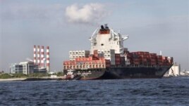 Commerce department report indicates U.S. businesses boosted inventory to spur better-than-expected growth. Above, a container ship on its way to unload its cargo at Port Everglades in Fort Lauderdale, Florida, Sept. 27, 2012.