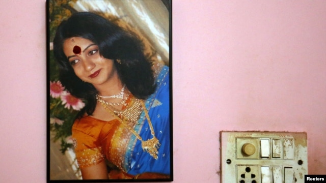 A portrait of Savita Halappanavar is seen on the wall of her parents' home in Belgaum in the southern Indian state of Karnataka, November 16, 2012. 