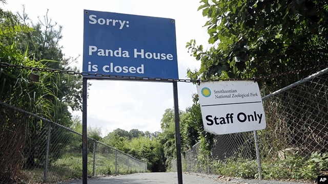 The closed signs posted at the Panda exhibit at the National Zoo in Washington the day after it was announced that the Zoo’s female giant panda gave birth to a cub, Sept. 17, 2012.