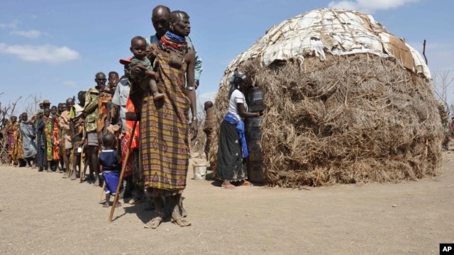 Turkana people wait in a line to receive food from Oxfam in central Turkana district, Kenya in August 2011. The U.N. says tens of thousands of people died in Somalia, Kenya, Ethiopia and Djibouti from famine. Five years later, drought has returned. 