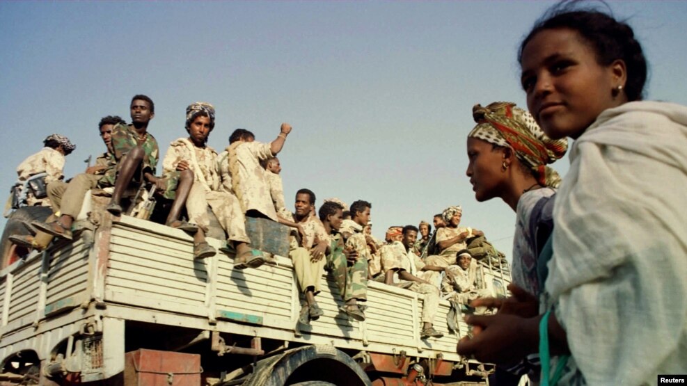 FILE - Eritrean soldiers celebrate the country's anniversary of independence from Ethiopia May 23, 2000. Eritrean and Ethiopian troops clashed June 12, with each accusing the other of starting the hostilities.