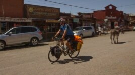Deven Perkins is riding his bike from Maine to California