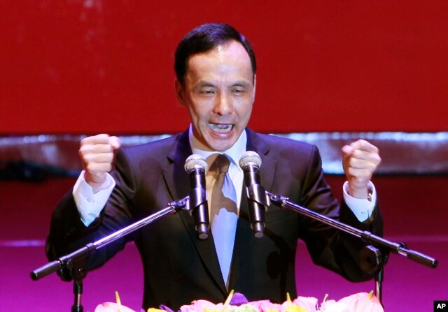 Taiwan's ruling Nationalist Party chairman and presidential candidate in the 2016 elections, Eric Chu, gestures during an extraordinary party congress in Taipei, Taiwan, Saturday, Oct. 17, 2015.