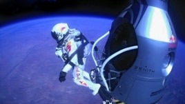 Felix Baumgartner of Austria jumping out of the capsule