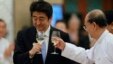 Japan's Prime Minister Shinzo Abe (L) and Burma's President Thein Sein toast during lunch at the Myanmar International Convention Center in Naypyitaw, May 26, 2013.