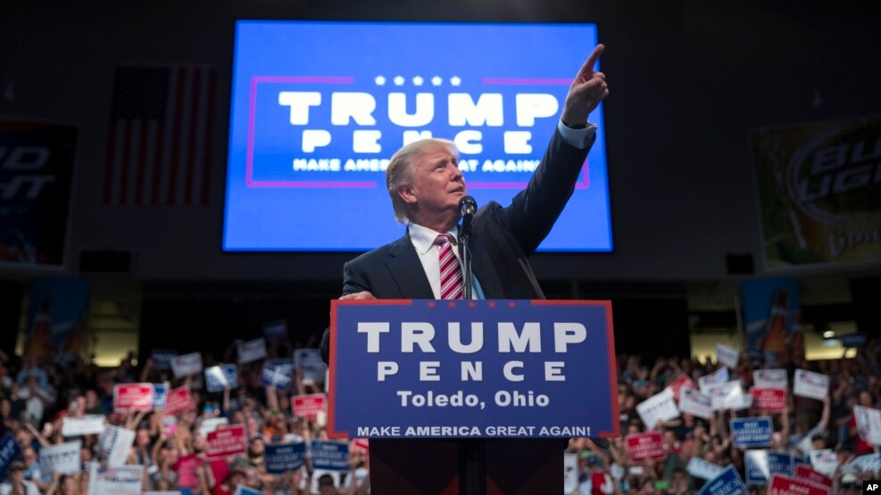 Republican presidential candidate Donald Trump points to the crowd as he speaks during a campaign rally, July 27, 2016, in Toledo, Ohio.