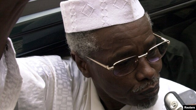 Former Chad President Hissene Habre talks to reporters as he leaves a court in Dakar, Senegal on November 25, 2005.
