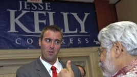 U.S. Republican Congressional candidate Jesse Kelly greets supporters Tuesday, Nov. 2, 2010, at an election night rally in Tucson, Ariz.