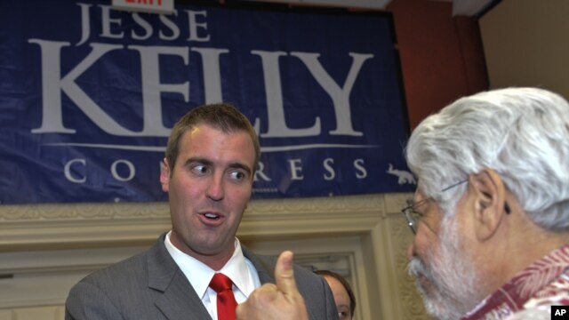 U.S. Republican Congressional candidate Jesse Kelly greets supporters Tuesday, Nov. 2, 2010, at an election night rally in Tucson, Ariz.