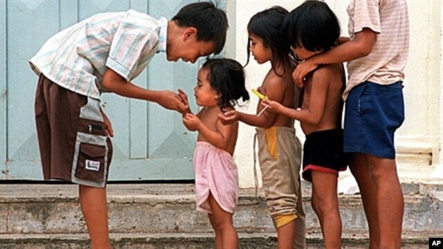Cambodian orphans play together as they wait for adoption at Kien Klaing orphanage center in Phnom Penh, (File)