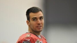 Baltimore Ravens quarterback Joe Flacco looks towards the media during football practice, Jan. 26, 2013 in Owings Mills, Md.