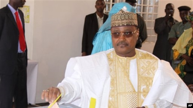 Presidential candidate Seini Oumarou, a former prime minister under deposed president Mamadou Tandja, casts his vote in Niamey, Niger, Monday, Jan. 31, 2011. This impoverished country on the edge of the Sahara took another stab at democracy Monday when it