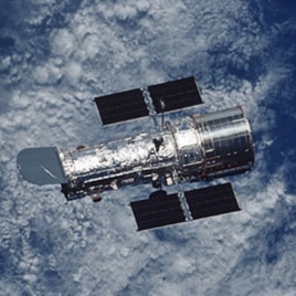 The Hubble Space Telescope, a large, space-based observatory, has revolutionized astronomy by providing unprecedented deep and clear views of the universe.