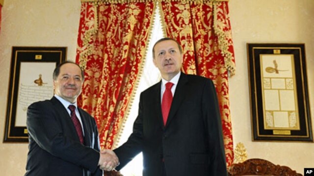 Turkish Prime Minister Tayyip Erdogan (R) and Kurdistan Region President Masoud Barzani shake hands before their meeting in Istanbul, April 19, 2012.