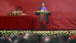 Burma's pro-democracy leader Aung San Suu Kyi delivers her speech at the National League for Democracy party's congress in Yangon March 10, 2013.