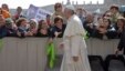 Faithful and tourists reach out to Pope Francis as he arrives for his weekly general audience, in St. Peter's Square at the Vatican, April 6, 2016. 