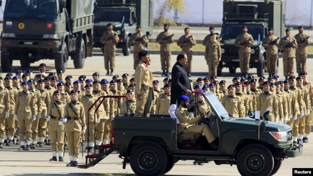 Pakistan's President Mamnoon Hussain inspects troops during Pakistan Day parade in Islamabad, March 23, 2015.