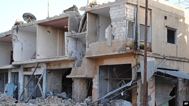 Shops and homes are seen after they were reportedly destroyed by Syrian government shelling in Rastan town in Homs province, central Syria, March 20, 2012. 