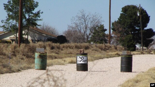 The driveway to the Shatto family home, rear left, is seen in Gardendale, Texas, Friday, March 1, 2013.