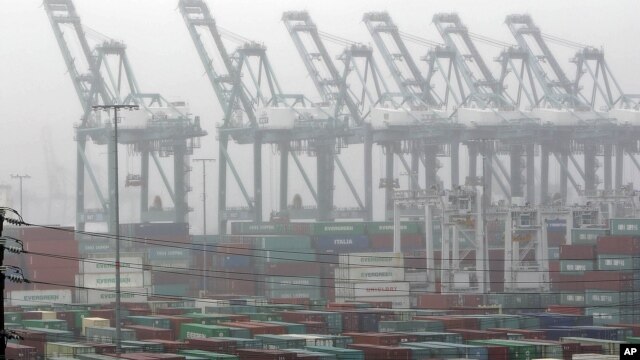 The Maersk cargo terminal, where container-handling cranes are in the up and idle position, is seen at the Port of Los Angeles, Nov. 29, 2012. Cargo ships were stacking up at the ports of Los Angeles and Long Beach as a strike by about about 70 clerical workers shut down most terminals that together are the nation's busiest port complex.