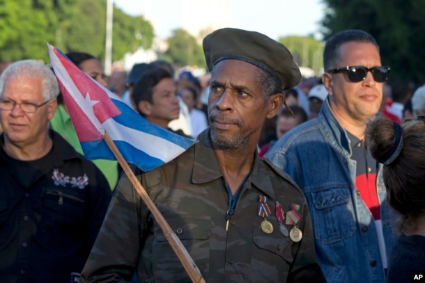 Ernesto Barbon, a veteran of the Angola war where Cuban troops fought in the 80s, waits in line to enter the Revolution PLaza, to render homage to Fidel Castro in Havana, Cuba, Nov. 28, 2016.