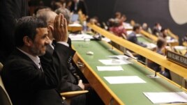 Iranian President Mahmoud Ahmadinejad gestures as he arrives at his seat before addressing the 67th session of the UN General Assembly at UN. headquarters in New York, September 26, 2012.