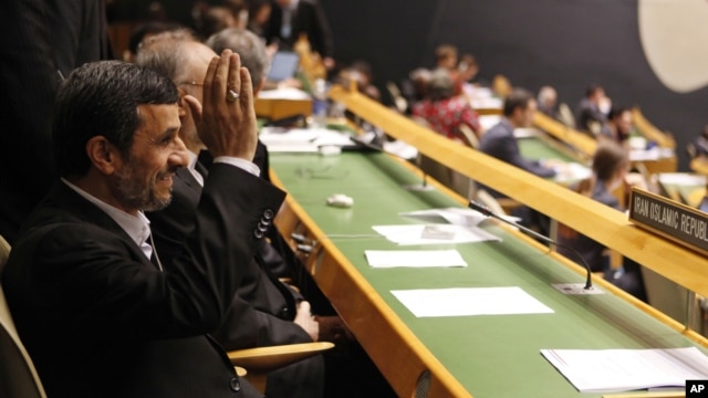 Iranian President Mahmoud Ahmadinejad gestures as he arrives at his seat before addressing the 67th session of the UN General Assembly at UN. headquarters in New York, September 26, 2012.