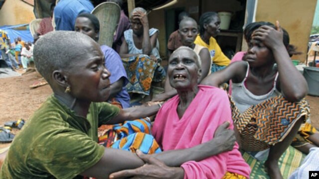 Refugees of the Guere ethnic group mourn the death of a relative, inside a temporary camp set up at a Catholic church in Duekoue, Ivory Coast, May 2011. (file photo)