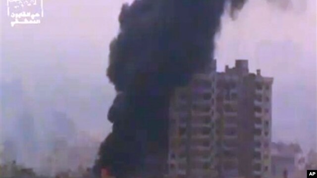 Ugarit News image of smoke and fire billowing from an explosion in Damascus, Syria, Feb. 6, 2013