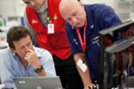 BP Group Chief Executive Tony Hayward discusses the operation with a US Coast Guard official.