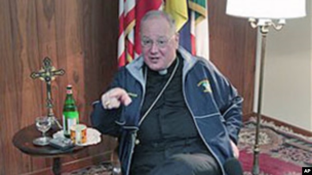 Archbishop of New York, Timothy Dolan, gestures during an interview at the North American College in Rome, February 14, 2012.