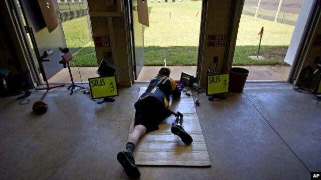 U.S. Army Sergeant Josh Olson takes practice on the shooting range at Fort Benning, Georgia and he trains for the upcoming Paralympic Games, May 30, 2012.
