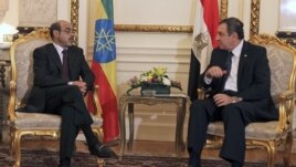 Ethiopian Prime Minister Meles Zenawi, left, meets with then-Egyptian Prime Minister Essam Sharaf, right, in Cairo, Egypt, September 17, 2011.