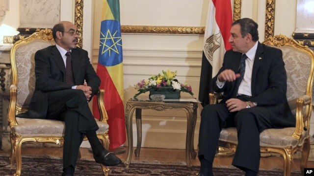 Ethiopian Prime Minister Meles Zenawi, left, meets with then-Egyptian Prime Minister Essam Sharaf, right, in Cairo, Egypt, September 17, 2011.