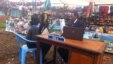 County assembly member Karungo wa Thang'wa meets with constituents at a market outside Nairobi every Tuesday as he waits for the government to pay for an office, Kenya. (G. Joselow/VOA)