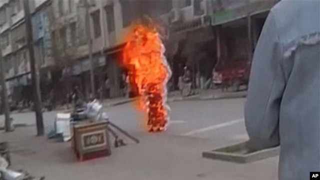 Tibetan Buddhist nun Palden Choetso sets herself ablaze in Chinese-ruled Tibetan autonomous region, Nov. 3, 2011.