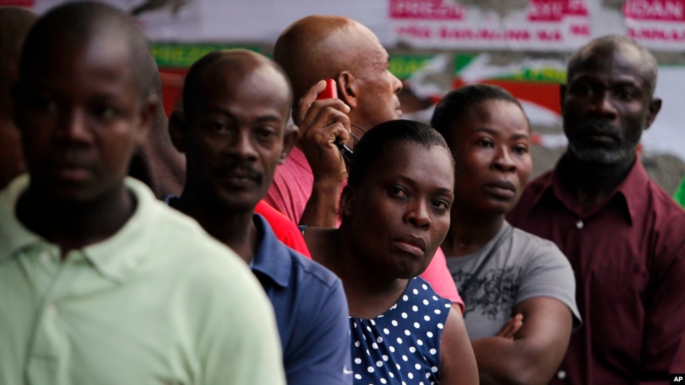 People stand in line to vote during elections in the Petion-Ville suburb of Port-au-Prince, Haiti, Nov. 20, 2016.