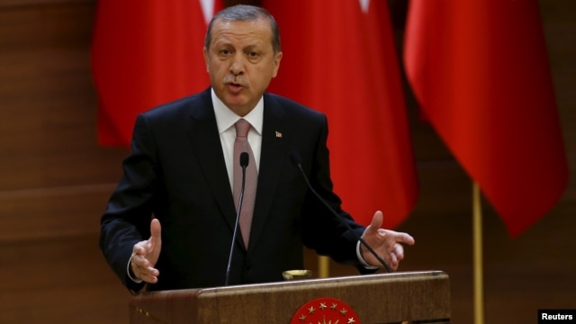 FILE - Turkish President Recep Tayyip Erdogan makes a speech at the Presidential Palace in Ankara, Nov. 26, 2015.  Ankara summoned the American ambassador, John Bass, on Feb. 9, 2016, to protest remarks by a State Department spokesman who said Washington does not consider Syria's Kurdish Democracy Union Party (PYD) a terrorist organization.