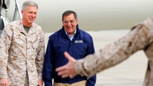 FILE - Lt. General Thomas Waldhauser, left, of 1st Marine Expeditionary Force greets then-U.S. Secretary of Defense Leon Panetta upon his arrival at Camp Pendleton, California, March 30, 2012. Waldhauser is President Barack Obama's nominee to lead the U.S. mi