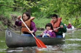 Students paddle along the Kickapoo River, where a 20-year preservation venture stopped encroachment by developers.