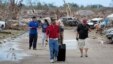Residents remove their belongings from a residential area in Moore, Oklahoma on May 21, 2013 after a massive tornado struck the area.