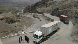 Border guards check trucks en-route to neighboring Afghanistan in Pakistan's tribal area of Khyber, July 4, 2012.