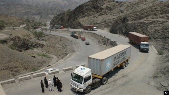 Border guards check trucks en-route to neighboring Afghanistan in Pakistan's tribal area of Khyber, July 4, 2012.